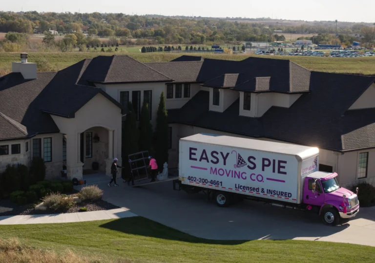 Aerial view of an Easy As Pie moving truck outside a home