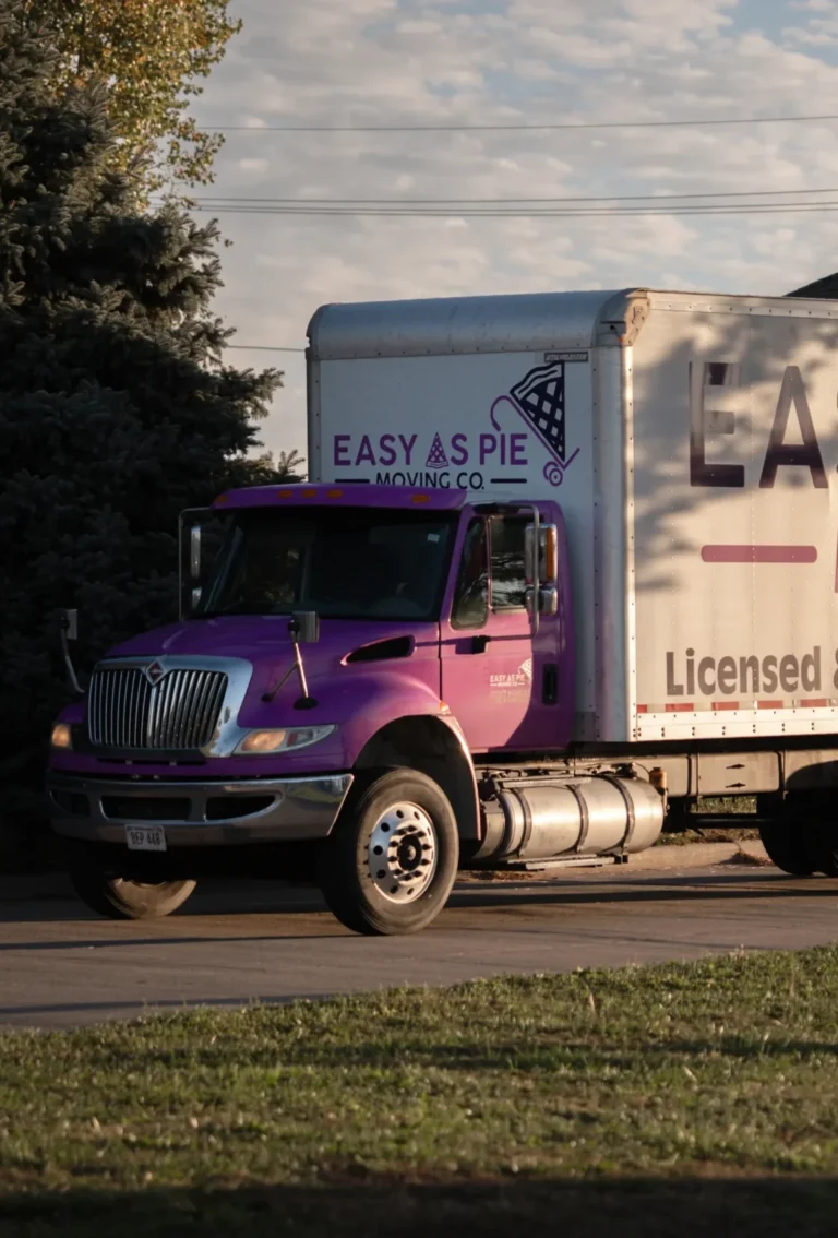 Easy As Pie Moving Co. truck parked at a home
