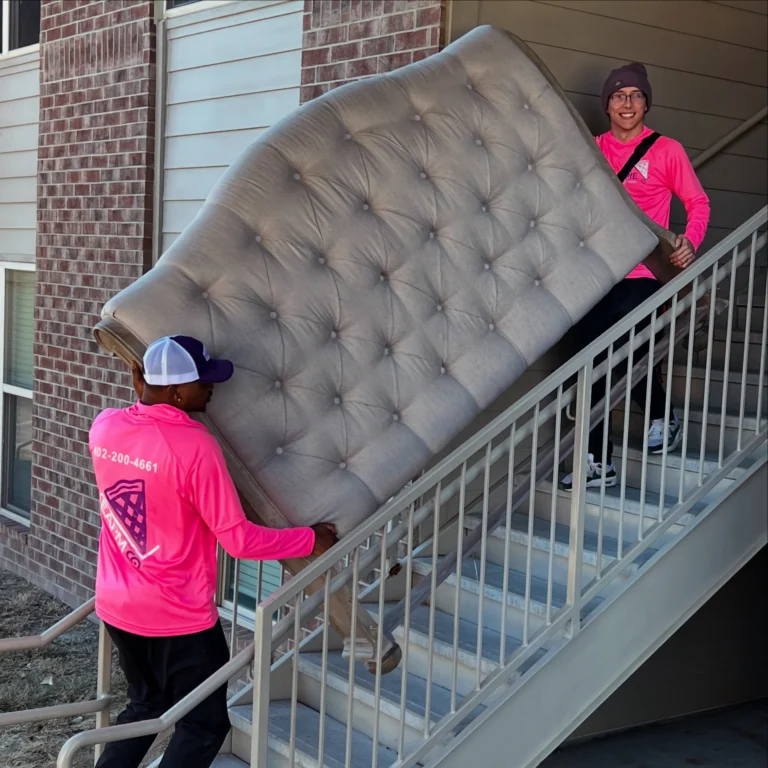 Easy As Pie mover carrying a headboard up the stairs