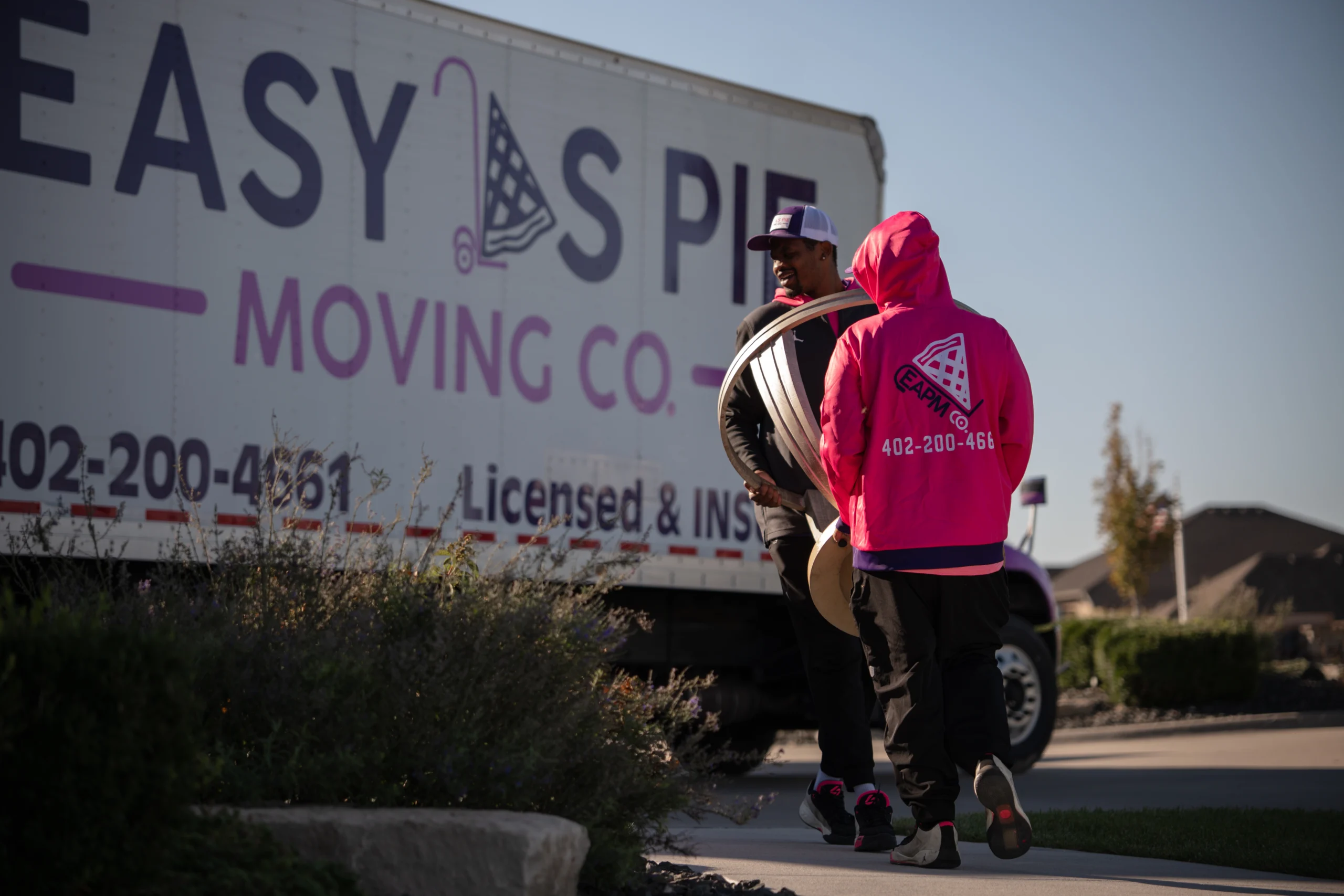 Easy As Pie crew moving furniture beside the truck