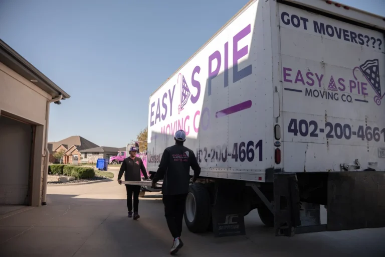 Easy As Pie movers walking toward their moving truck