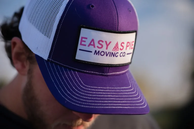 Easy As Pie mover wearing a branded company hat