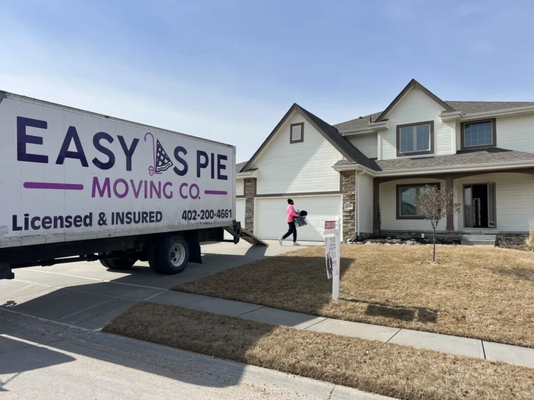 Easy As Pie Moving Co. truck parked in an Omaha neighborhood