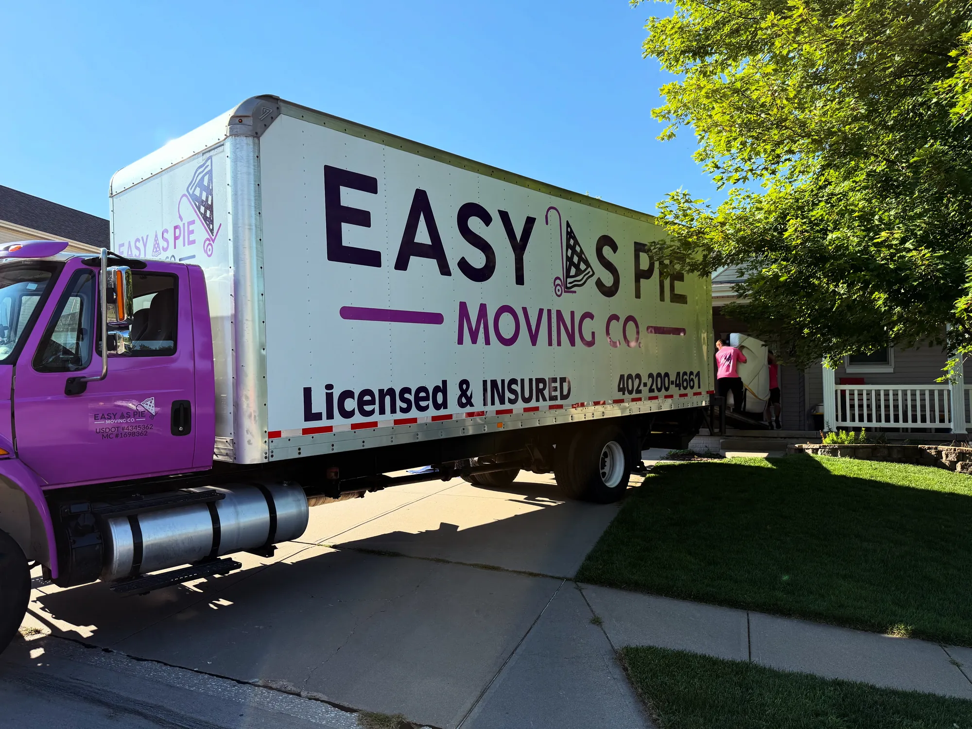Easy As Pie Moving Co. truck parked on a residential street