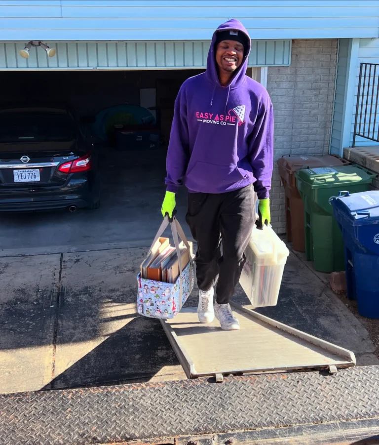 Easy As Pie mover carrying bags out of a garage cleanout