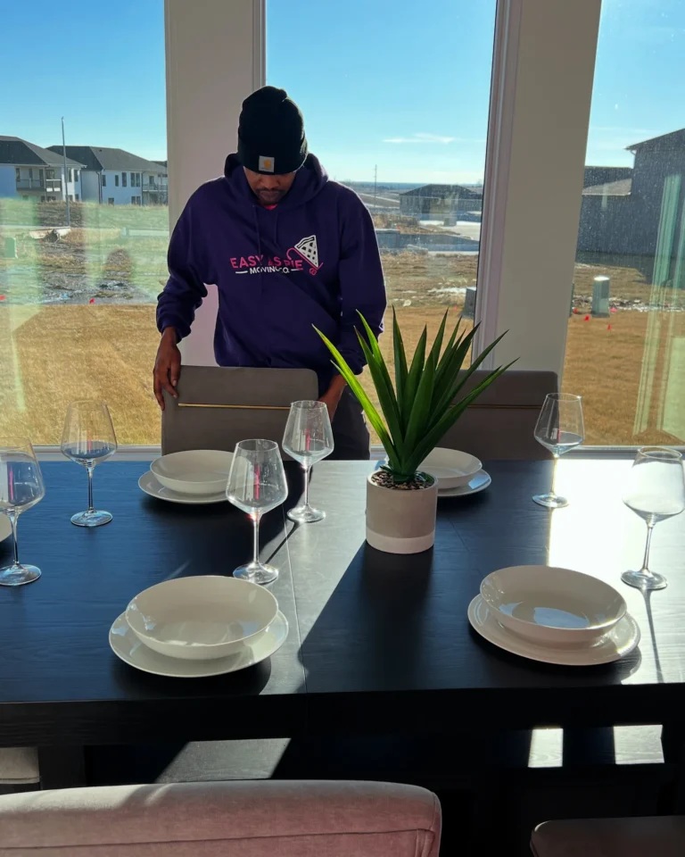 Easy As Pie mover setting the dining table after unpacking
