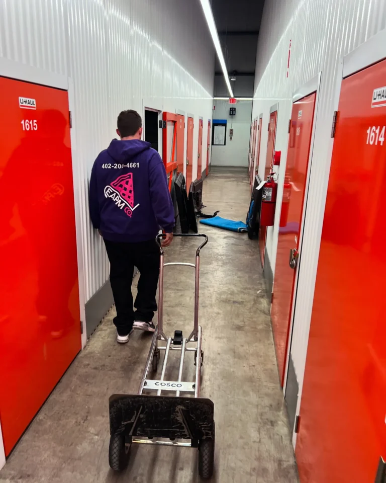 Easy As Pie mover with a hand truck in a storage facility hallway