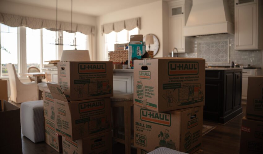 Moving boxes stacked and ready for transport. Moving into an apartment with easy as pie moving