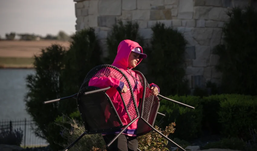 Easy as Pie Omaha local movers transporting outdoor chairs during a home move.