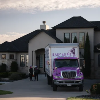 A team of Easy as Pie long distance movers loading furniture into the moving truck during an interstate omaha move.