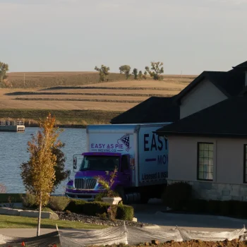 Easy As Pie Moving Co truck helping a family moving to Omaha with family into a lakeside neighborhood home