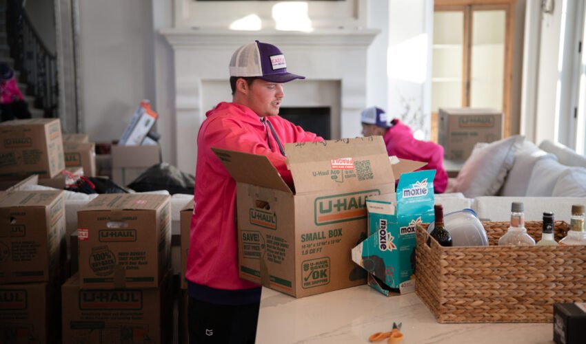 Team carefully packing living room items