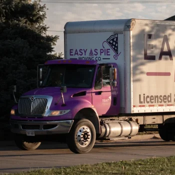 Easy as Pie long distance movers driving a branded moving truck during an interstate relocation.