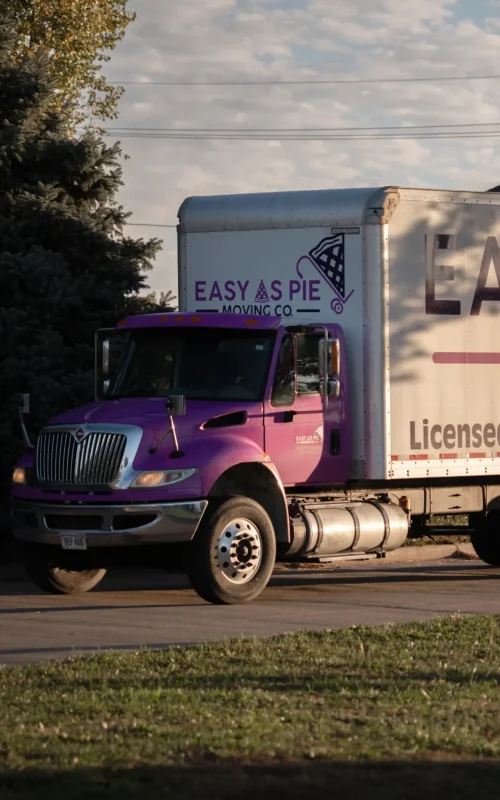 Easy as Pie long distance movers driving a branded moving truck during an interstate relocation.