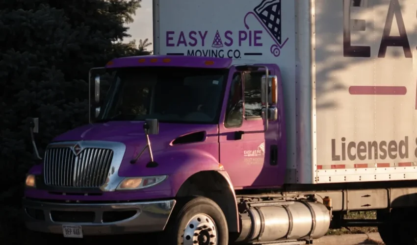 Easy as Pie long distance movers driving a branded moving truck during an interstate relocation.