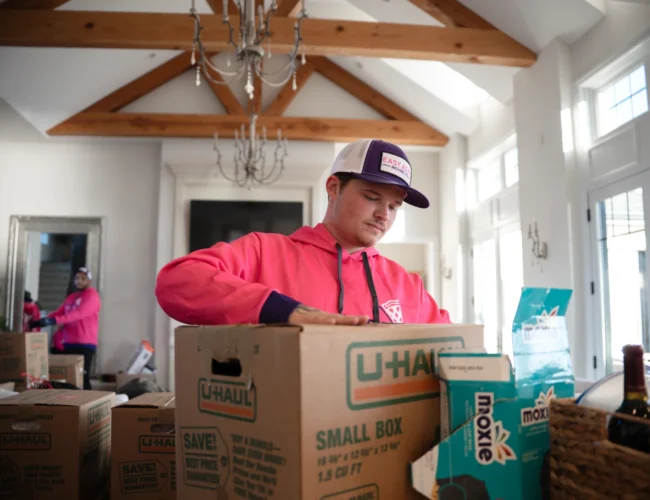 In state moving Nebraska team preparing boxes for delivery